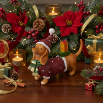 Article Dachshund déco en résine avec paquet cadeau et bonnet 18cm