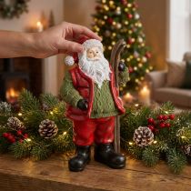 Article Figurine Père Noël décorative avec skis en résine peinte à la main 14 × 10,5 × 24,5 cm