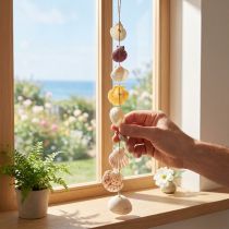 Article Guirlande décorative en coquillages naturels 70 cm