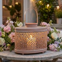 Article Lanterne décorative ovale en métal rose saumon avec motifs ajourés 27×16×23 cm