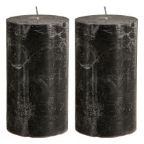 Article Bougies piliers noires 85×150mm (lot de 2), teintées dans la masse, élégantes pour la décoration et l'ambiance.