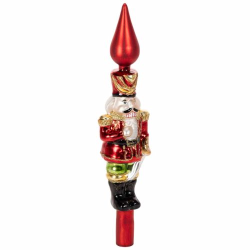 ProductNameCimier de sapin en verre, casse-noisette rouge, 28 cm/ ProductName
ProductDescription<h2>Cimier de sapin casse-noisette en verre pour décorer le sommet du sapin</h2>
<p>Ce cimier de sapin représente un casse-noisette en verre et sert à décorer  | Floristik24.fr