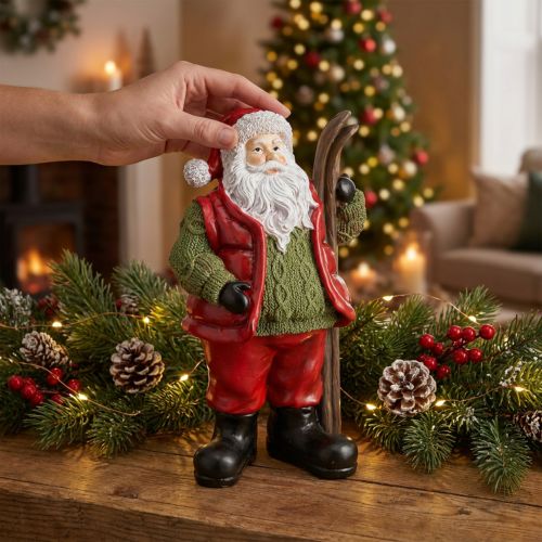 Figurine Père Noël décorative avec skis en résine peinte à la main 14 × 10,5 × 24,5 cm | Floristik24.fr
