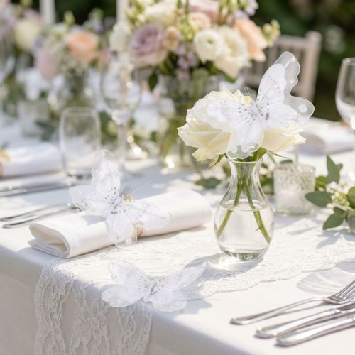 Papillons décoratifs à clip en plumes et tulle blancs 10 cm – Lot de 12 | Floristik24.fr