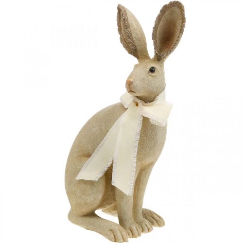 Floristik24 Lapin de Pâques assis avec noeud polyrésine décoration de table Pâques H30cm