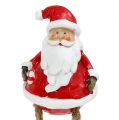 Floristik24 Figurine décorative Père Noël assis 6.5cm L10cm 4pcs