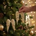 Lot de 4 décorations ailes d'ange dorées en métal 14,5 x 9 cm | Floristik24.fr