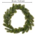 Couronne décorative artificielle en sapin vert 35 cm pour porte | Floristik24.fr