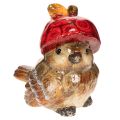 Floristik24 Décoration en céramique oiseau avec bonnet pomme rouge 13cm